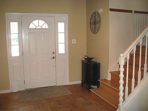 Foyer entry door with storm door