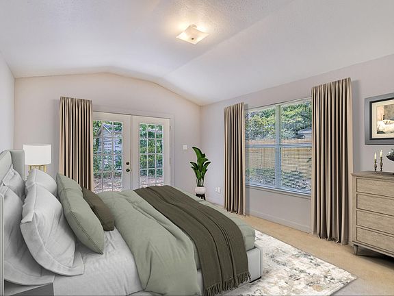 The generously sized bedroom features high ceilings, a large window that fills the room with natural light, a French door that opens to your private backyard, and a walk in closet.