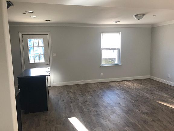 Large open floor plan of living, dining and kitchen.