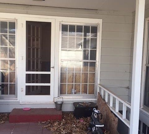Backporch, stairwell leading to the basement
