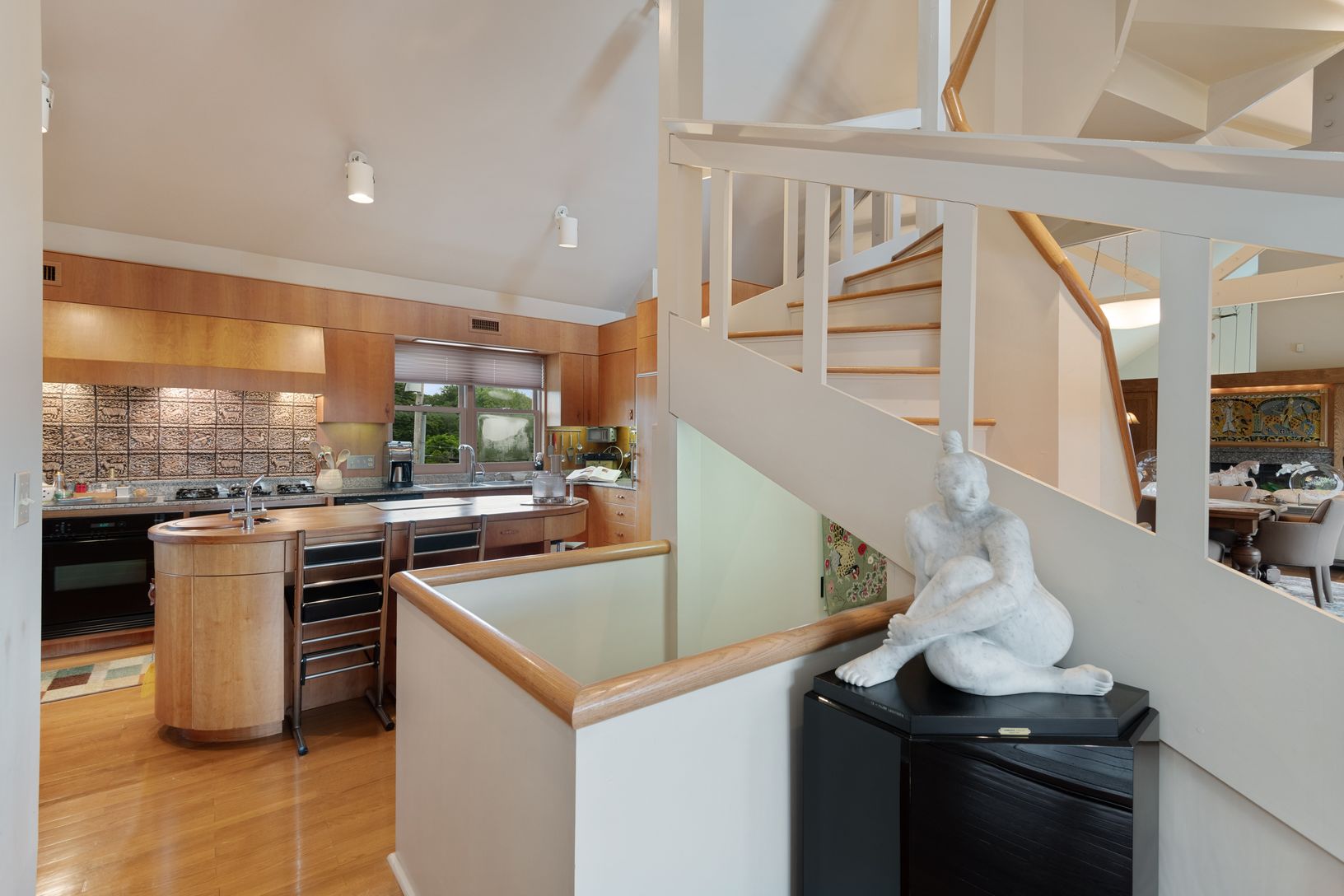  Uniquely Crafted Spiral Stairway Leading to Loft