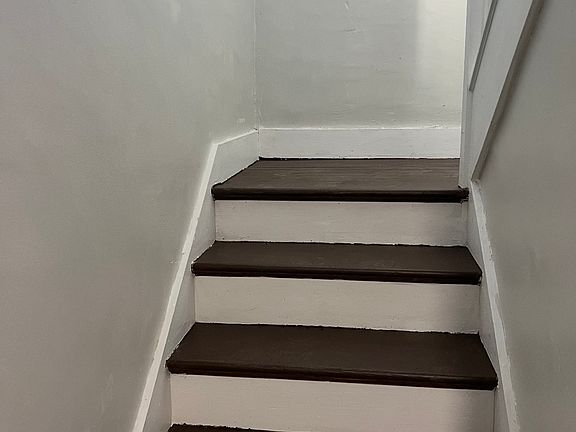 private entrance and stairs leading to the top floor