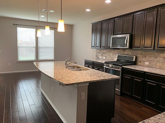 Room for a large dining table available in the attached dining area.