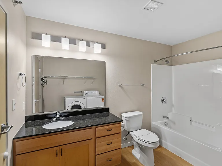 Transform your daily routine in this stylish bathroom at Overlook Ridge, featuring modern fixtures and ample storage. Enjoy a blend of functionality and comfort, perfect for unwinding after a long day. Schedule your visit today!
