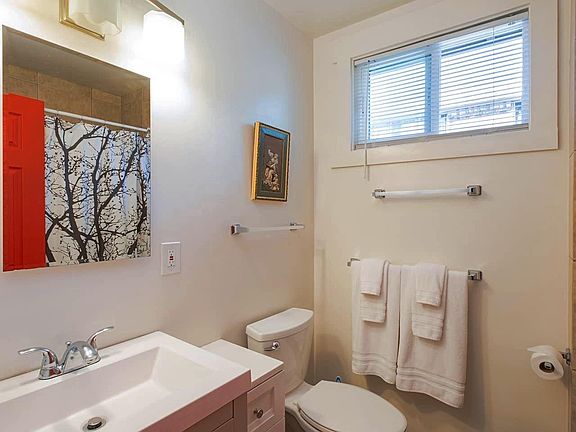 Bathroom with bathtub and shower.
