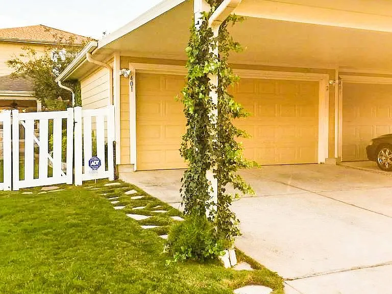 Ivy Trimmed Carport and Garage