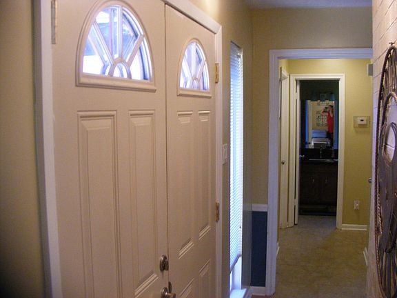 Entry looking towards secondary rooms and hall bath.