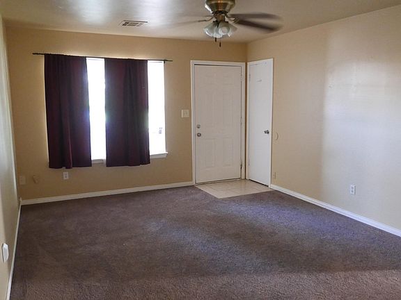 Living room with new carpet.