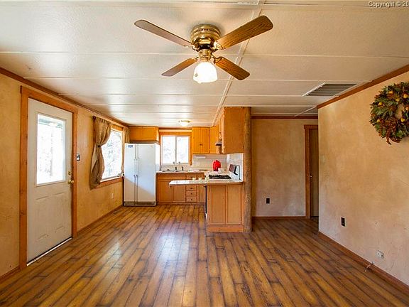 Open design from living room to kitchen and new flooring throughout