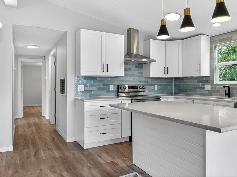 Open-Concept Kitchen and Living Area with Slider to Deck