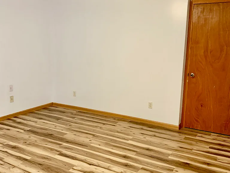 basement family room with storm shelter