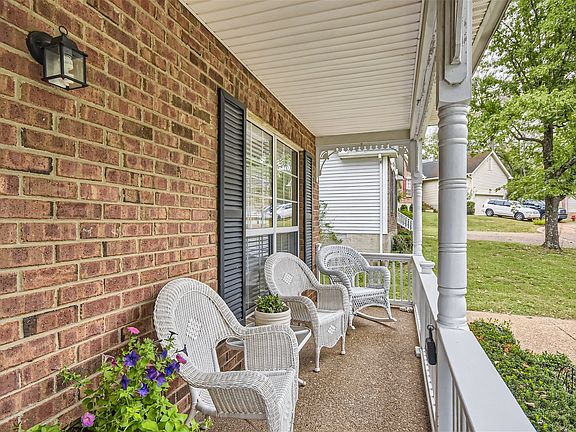 Beautiful front porch to sit and watch the wild turkey walk up the road