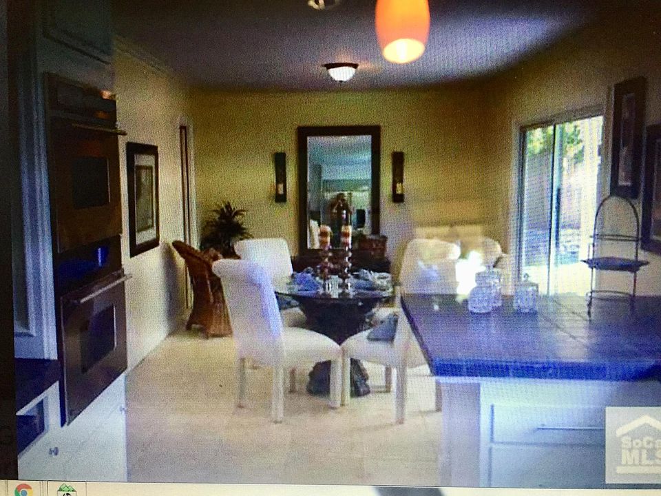 Kitchen opens to dining and lounging area