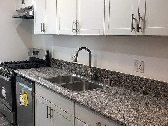 Newly remodeled kitchen with granite counters and new appliances.