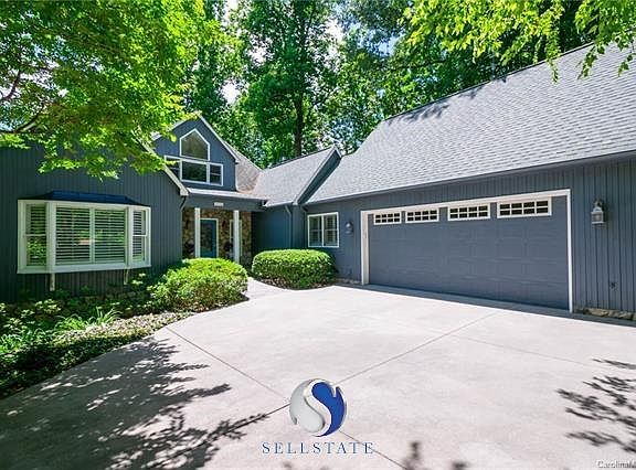 The circular drive sweeps up to this courtyard entrance to the home.