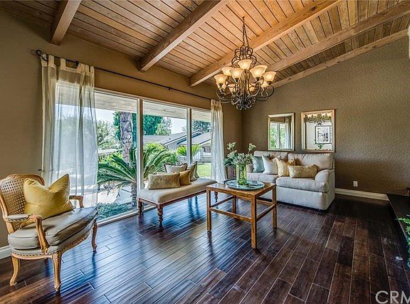 The oversized windows bring light and an inviting atmosphere to the Formal Living Room