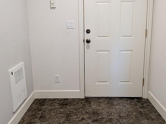 front door entrance. Garage access on the left