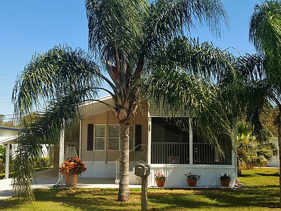 Front view of home beautiful palms