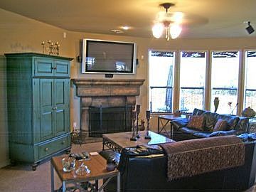 Family room has Custom Finish Fireplace.