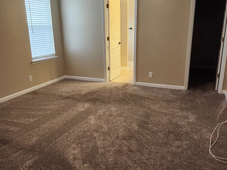 Large "Master Bedroom" with soft/new carpet; modern fan; spacious ceilings.