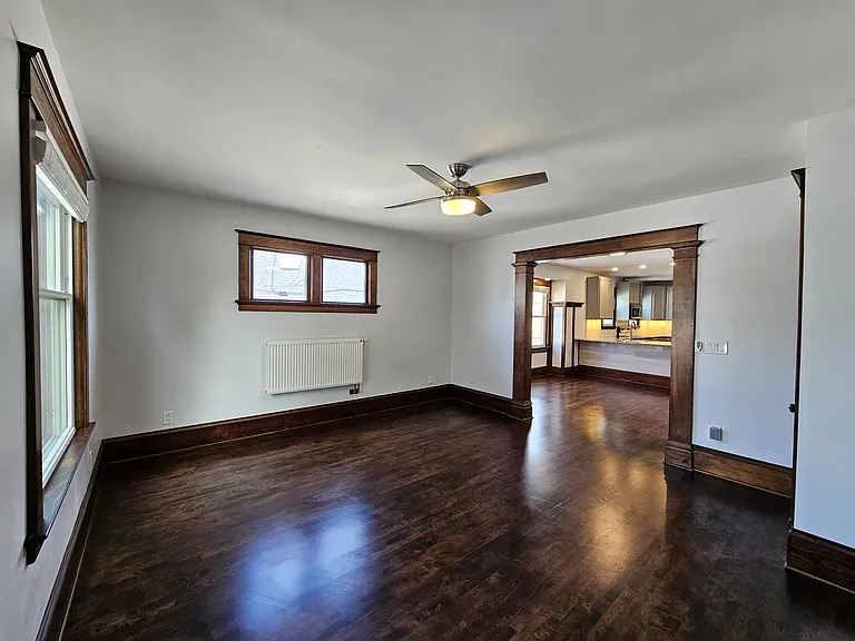 Unit floors are refinished original hardwood maple.