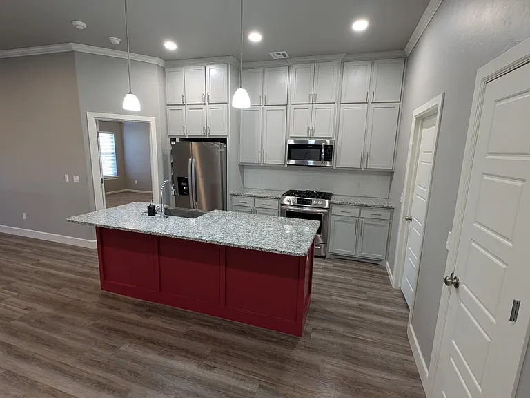 Kitchen Island & Gas Range & Oven.