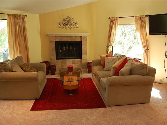 High ceilings in living room with picture windows.