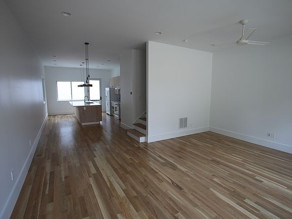 large lofty den, dining and kitchen