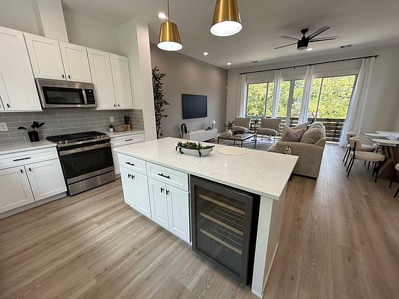 Kitchen also features a mini-fridge saving space in the primary refrigerator.