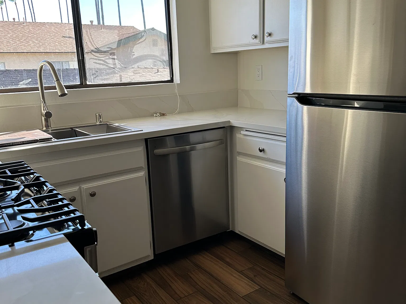 New refrigerator, dishwasher, stove and porcelain tile floor