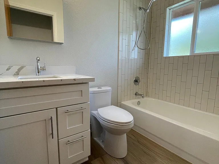 Unit 413 has refinished hardwood flooring rather than LVT like this unit 417