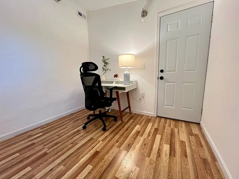 Spacious bedroom with room for a dedicated work desk or home office setup