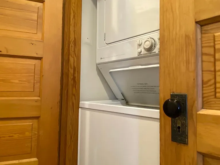 W/D with shelves for storage behind door on the right