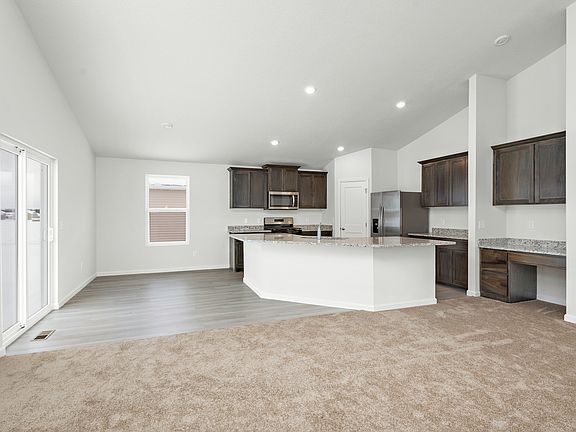 The entertainment space is open and including the dining room, kitchen, and family room