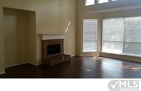 Huge living room with hard wood floors