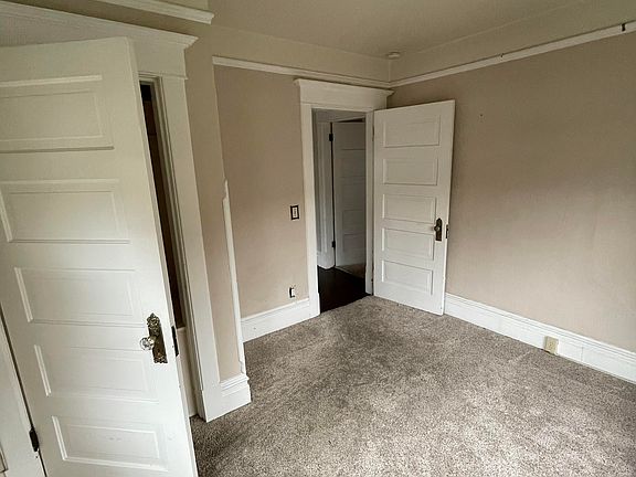Front north bedroom looking back toward entry from hall.