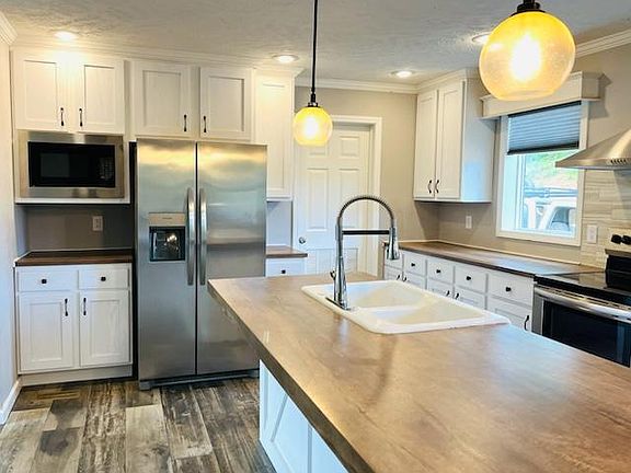 kitchen with door to laundry room shown