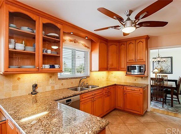 Check out this gorgeous custom cabinetry and granite in this upgraded kitchen