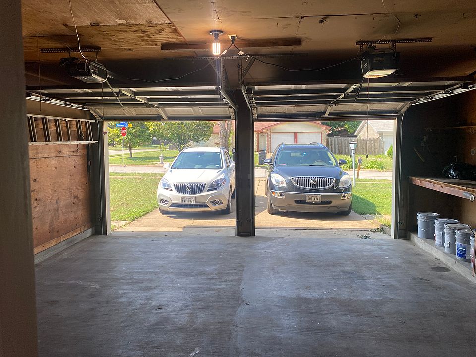 Dual, automatic garage doors with remotes