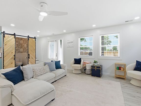 Living Room w/ downstairs bathroom.