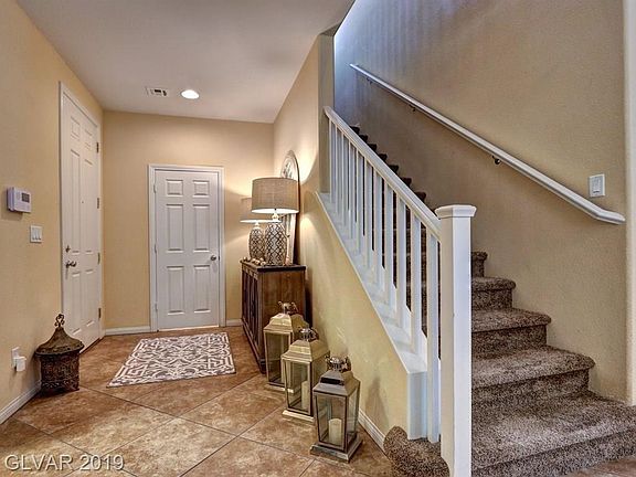 The front entry door is to the left and the door straight away is a half bath.