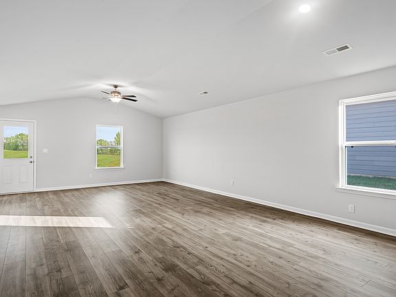The spacious family room is the perfect space for sports watch parties and family movie nights