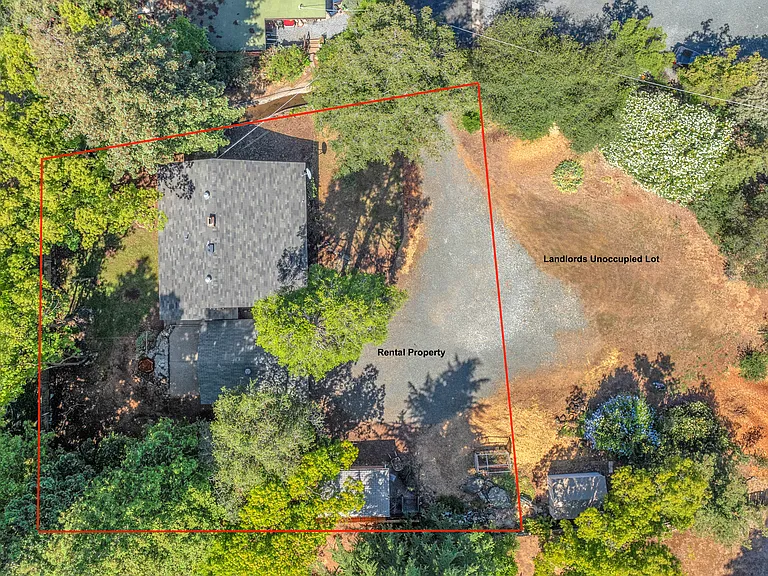 Image showing rental prop line and unoccupied lot owned by landlord