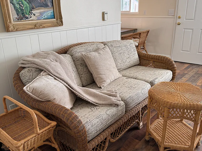 This is the living room with a sofa comfortable enough to sleep on.