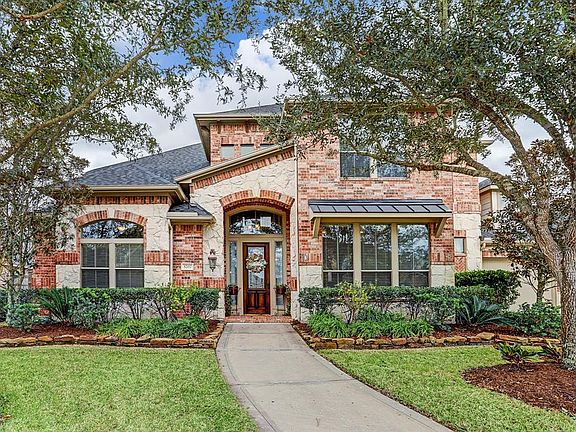 Upgraded elevation with brick and stone! There are nearby parks and trails right out a short walk from the front door!
