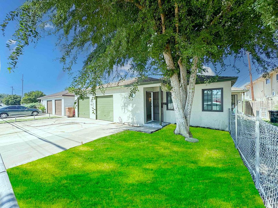 Grass has been digitally enhanced - the property now has mulch and flowers in the front yard.