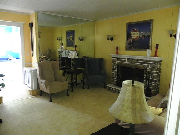 Front foyer opens onto beautiful  living room with gas fireplace.