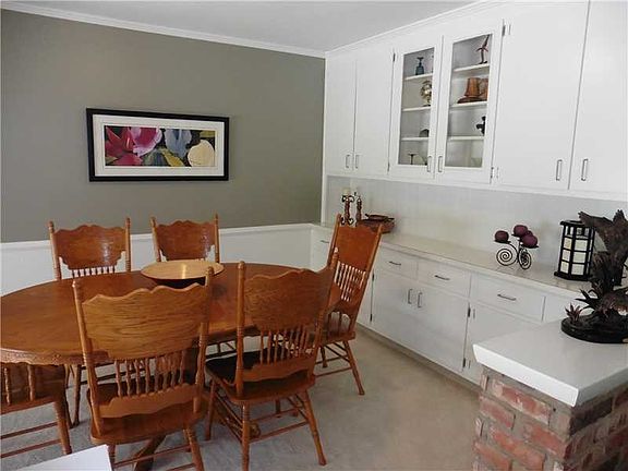 Dining Room. The Dining Room is open to the Great Room, and features a wall of built-in storage-- perfect for all your entertaining needs.  The home s interior was recently painted throughout.