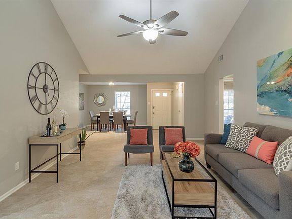 Step into this beautiful home with cathedral ceiling and fresh light gray paint throughout.