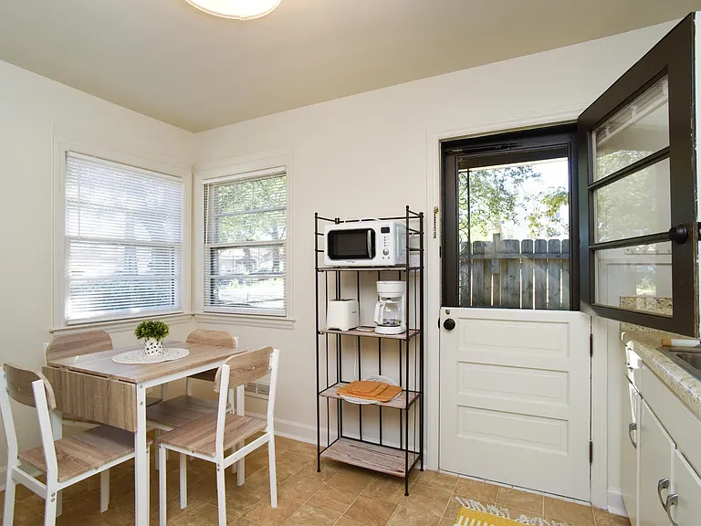 Kitchen with split door and screen door